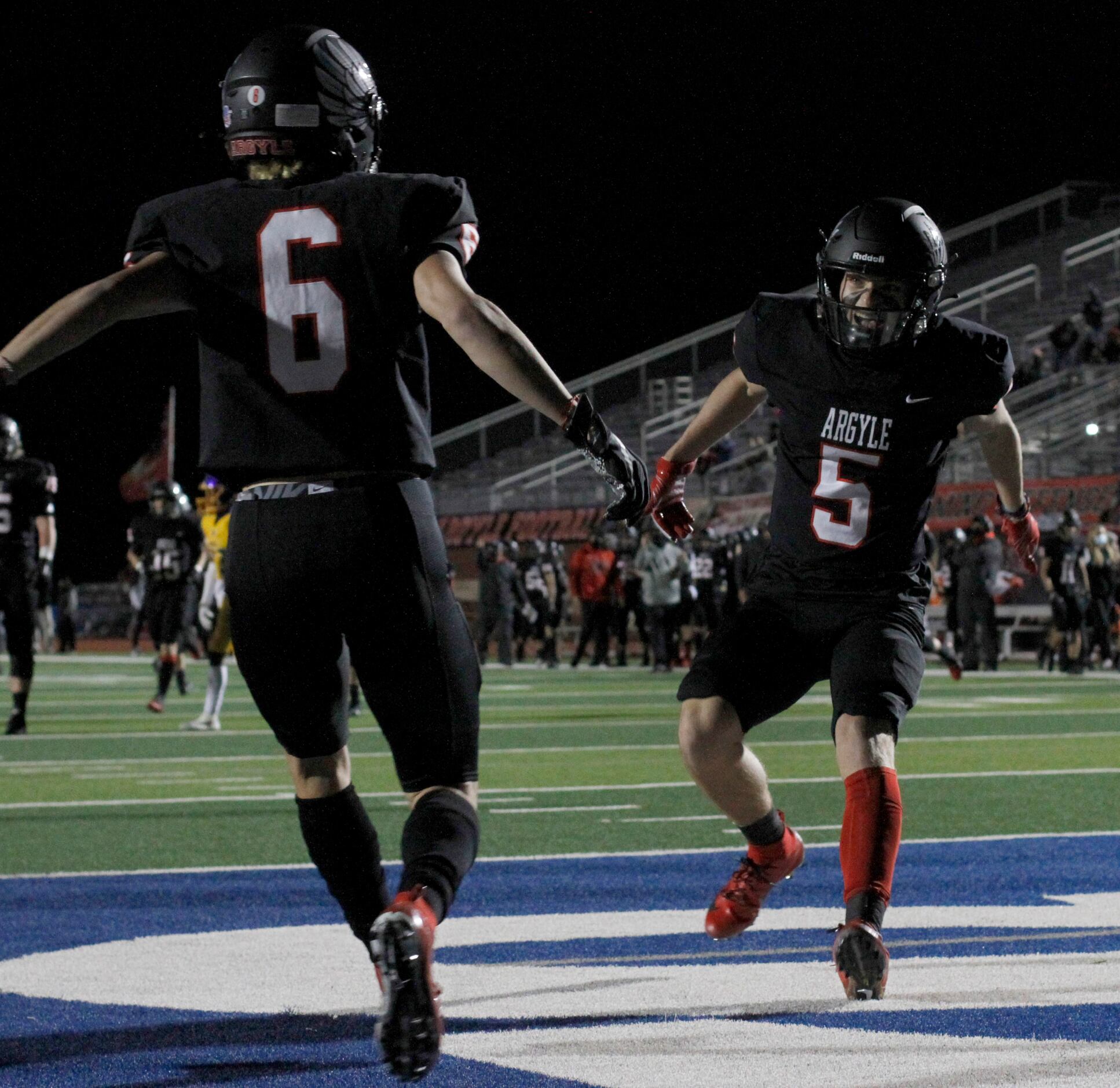 Argyle receiver Cole Kirkpatrick (5) was the first to congratulate fellow receiver Hayden...
