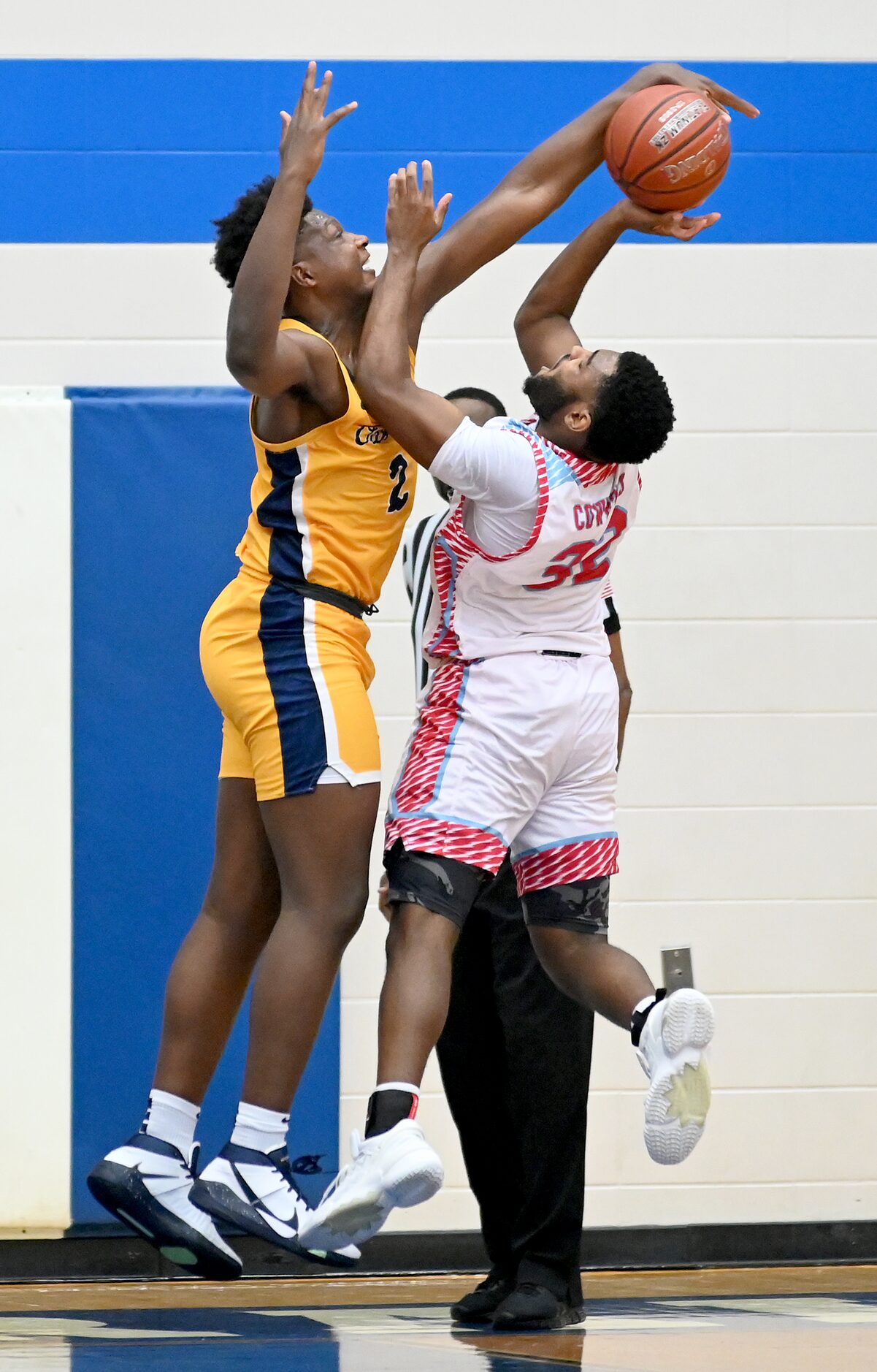 Faith Family’s Brandon Walker (2) blocks a shot by Carter’s Walter Taylor III in the second...