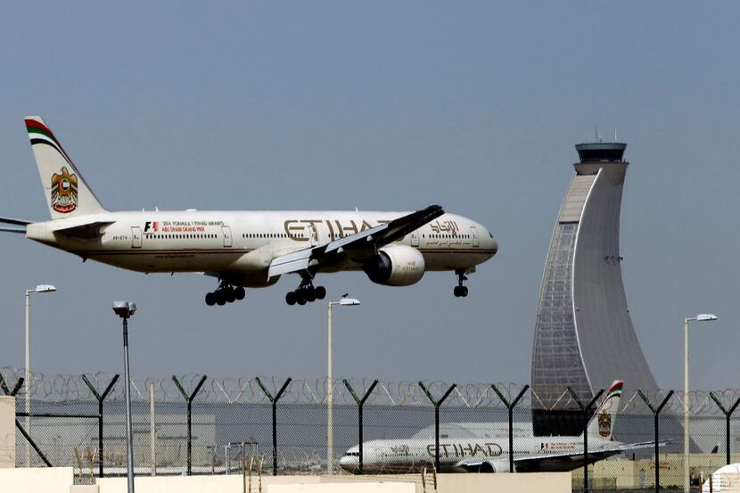 An Etihad Airways plane prepares to land at the Abu Dhabi airport in the United Arab...