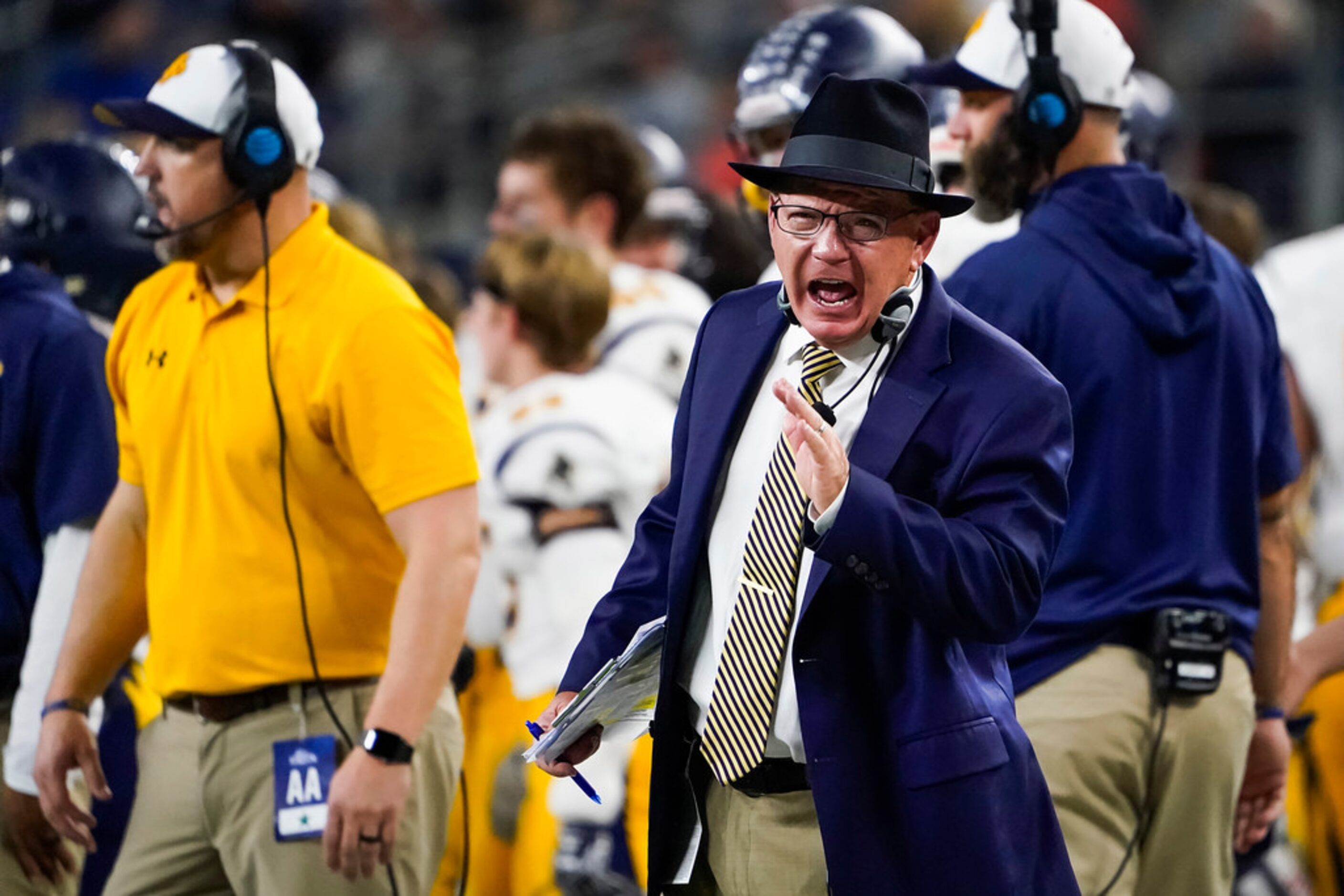 Highland Park head coach Randy Allen yells toward an official during the second half of a...