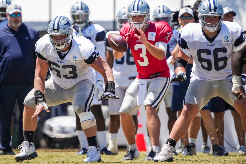 Dallas Cowboys center Tyler Biadasz (63) snaps the ball to quarterback Garrett Gilbert (3)...