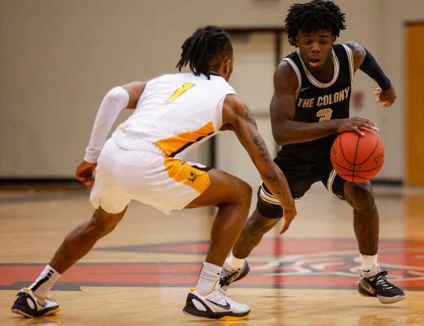The Colony High School Shenard Aiken (3) dribbles the ball up the court while Memorial High...