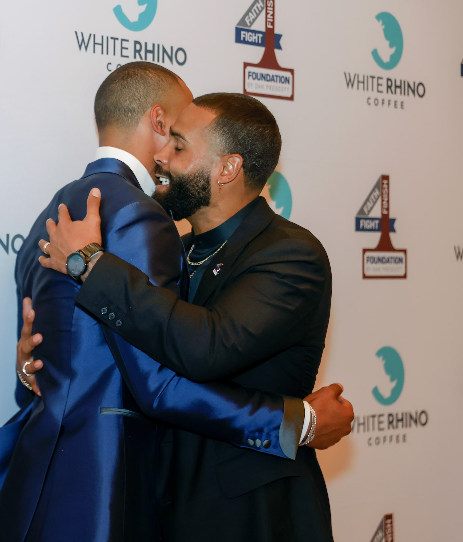 Dallas Cowboys quarterback Dak Prescott (left) and brother Tad Prescott (right) embrace...