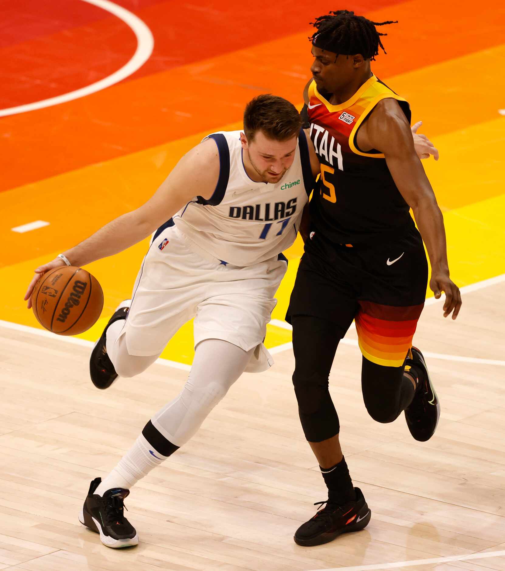 Dallas Mavericks guard Luka Doncic (77) brings the ball up the court as Utah Jazz forward...