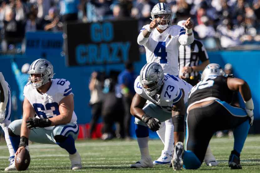 Dallas Cowboys quarterback Dak Prescott (4) motions before a play during the first quarter...