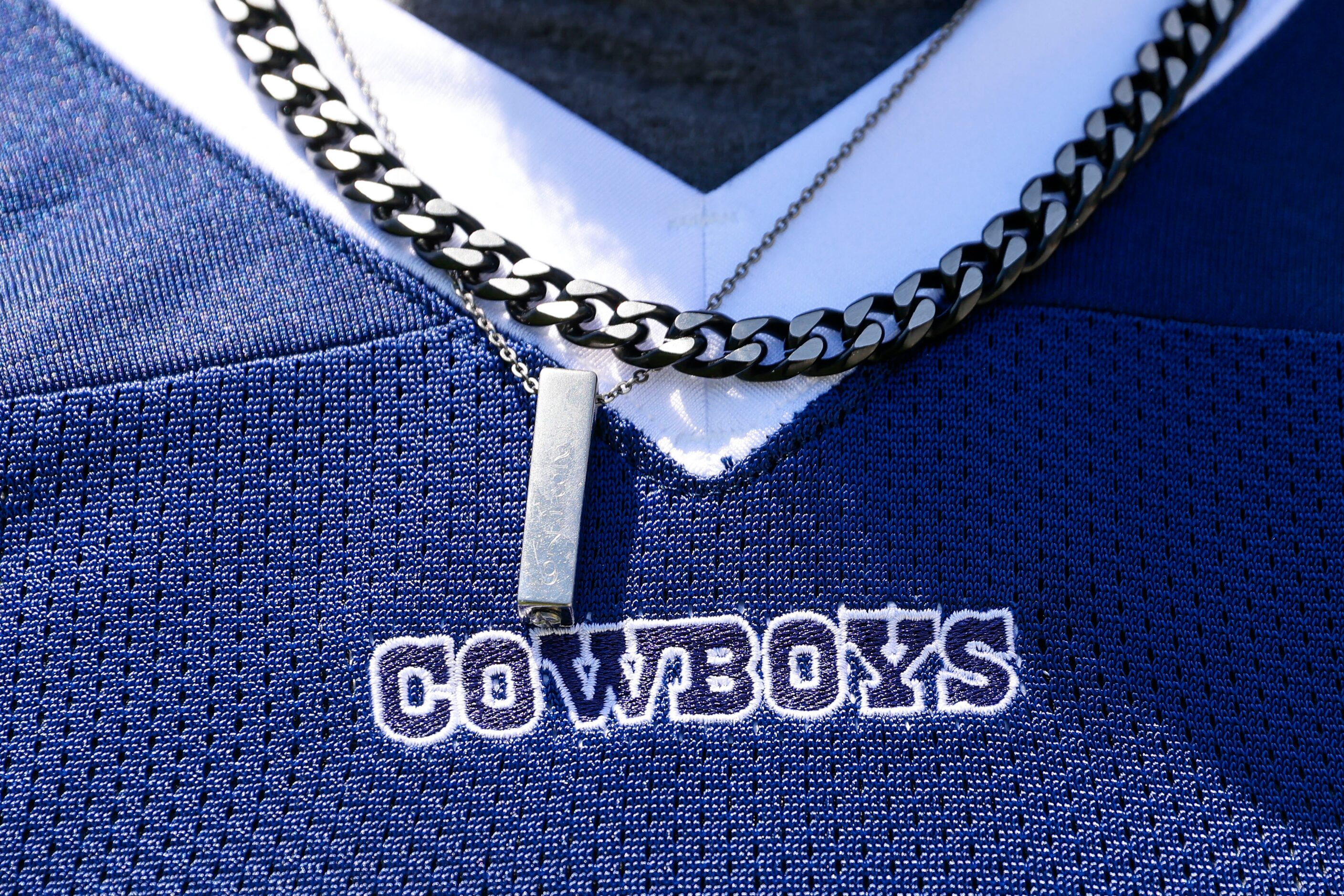 Urn necklace of Dallas Cowboys defensive end Marshawn Kneeland’s mother who passed away in...