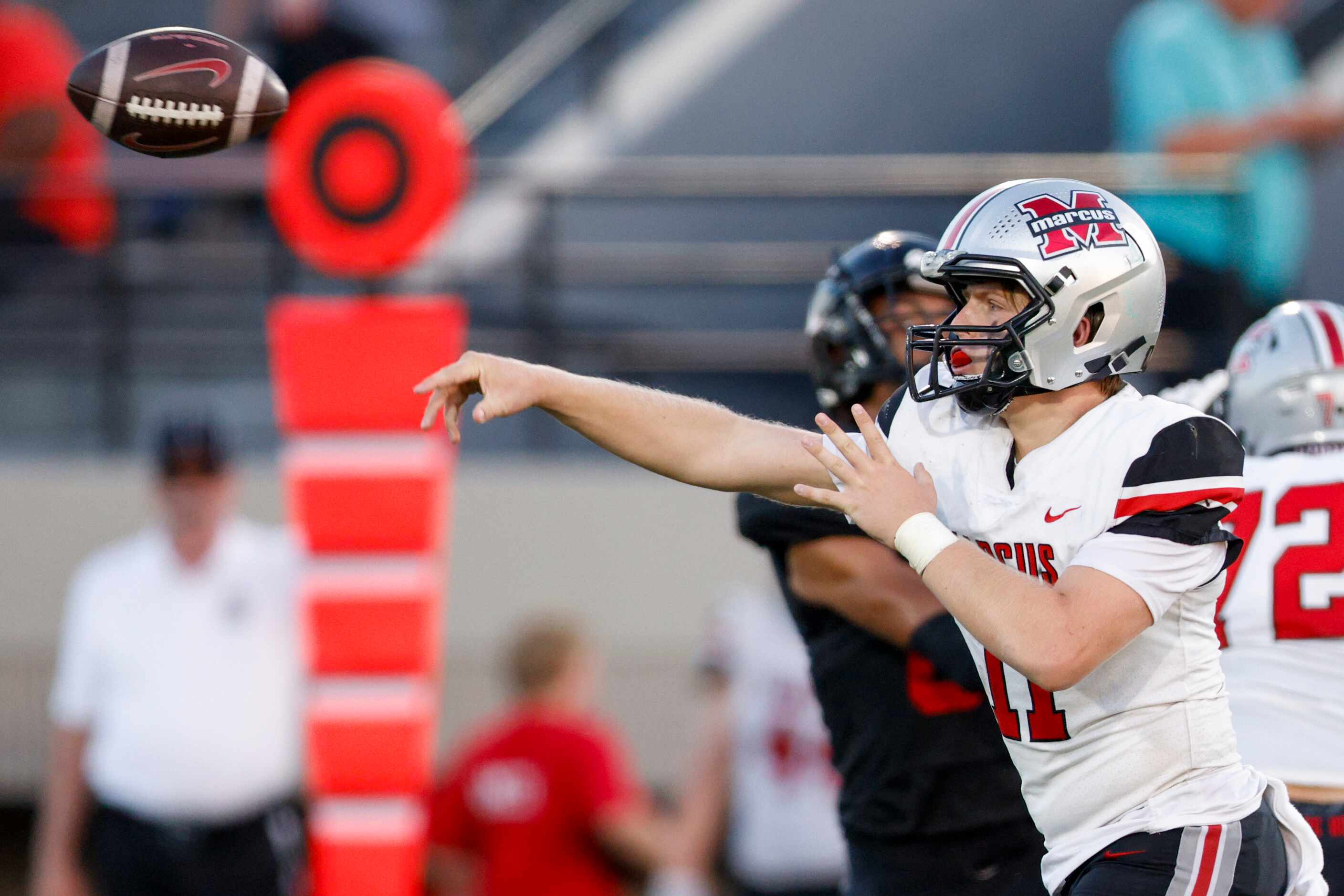 Flower Mound Marcus quarterback Dane Parlin (11) throws a pass during the first half of a...