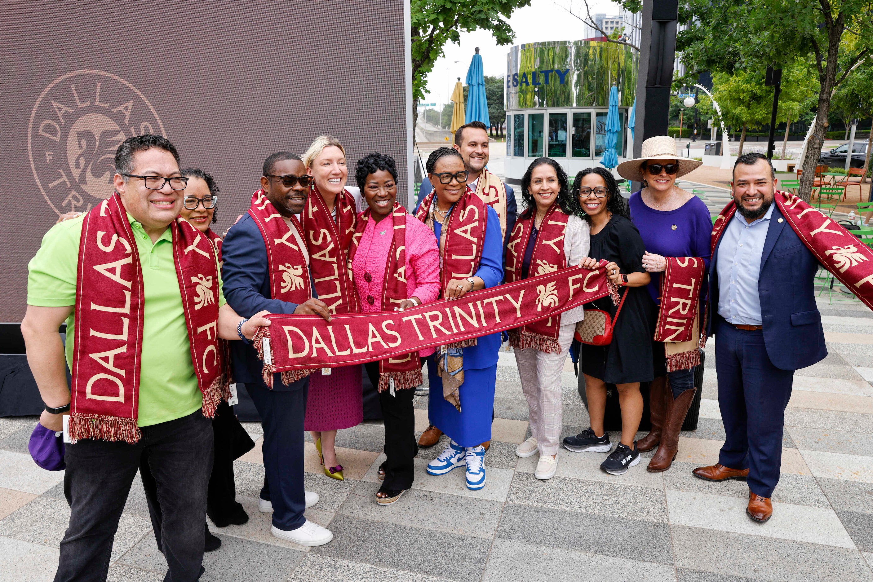 Members of the Dallas City Council and other local officials pose for photos after the...