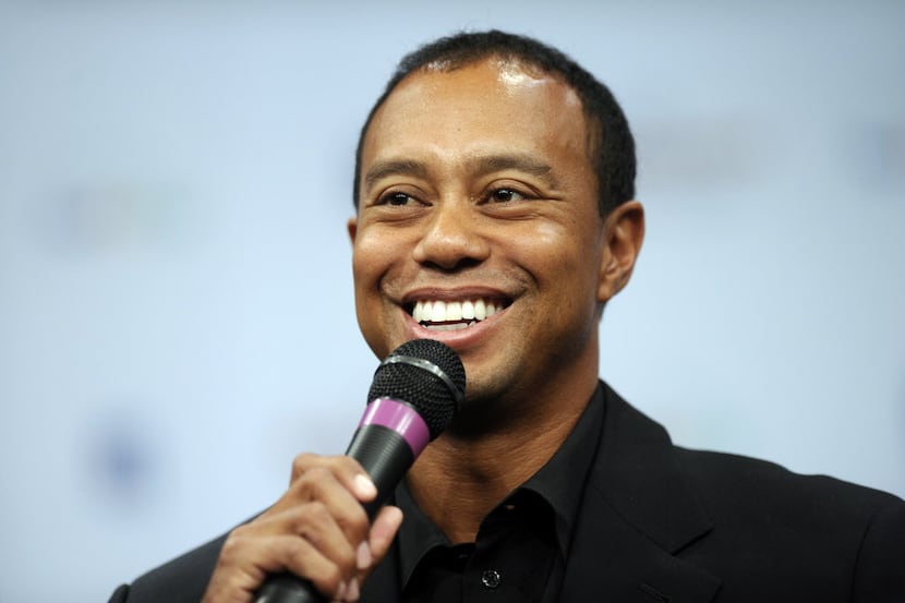 Tiger Woods speaks during a news conference at the Newseum in Washington, Monday, March 24,...