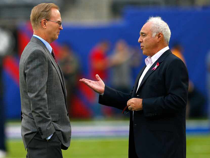 John Mara, president and chief executive of the New York Giants, speaks with Jeffrey Lurie,...