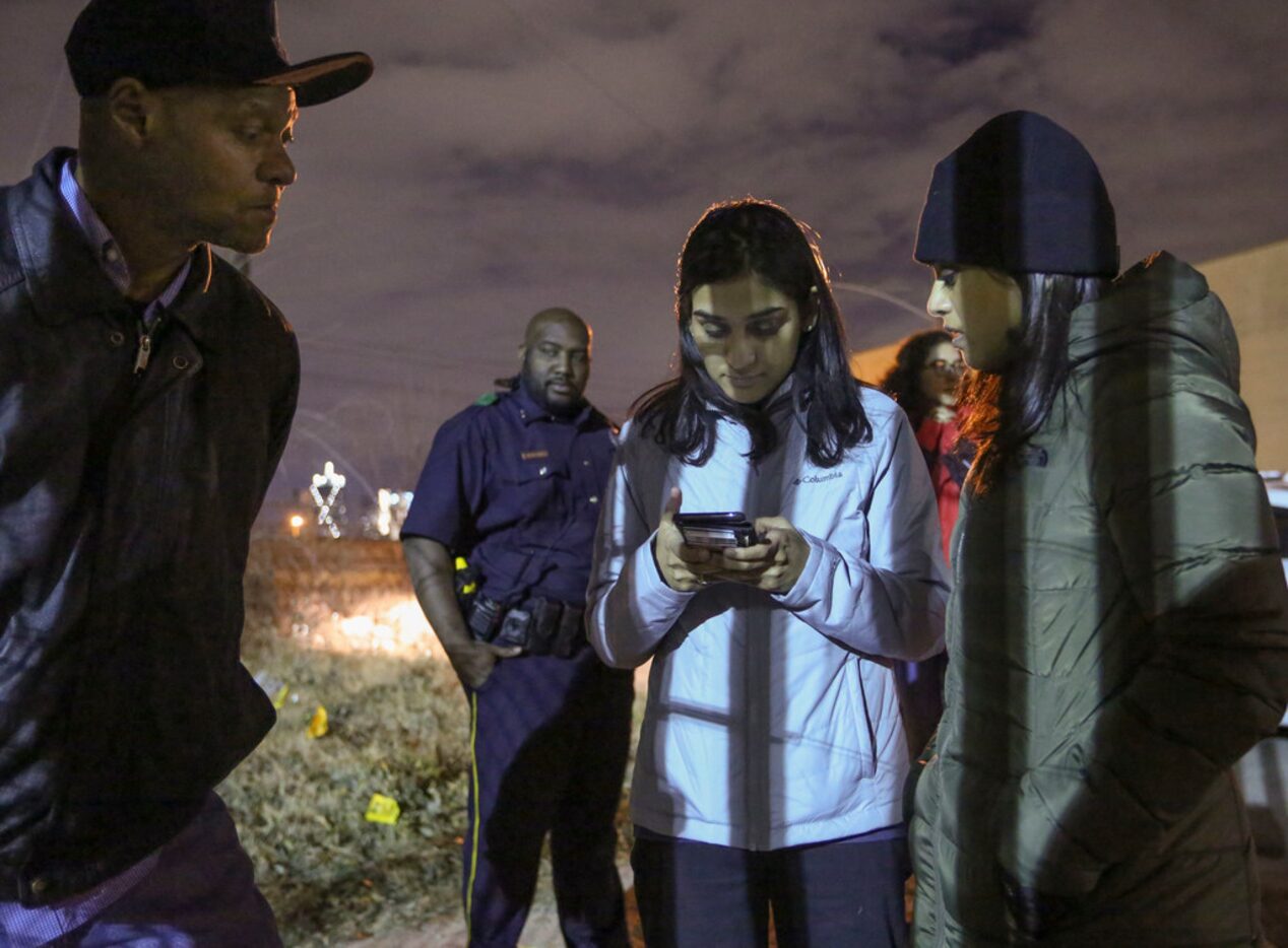 Willie Jones watches as Nazia Shaik (center) and Sana Syed record his answers as they count...