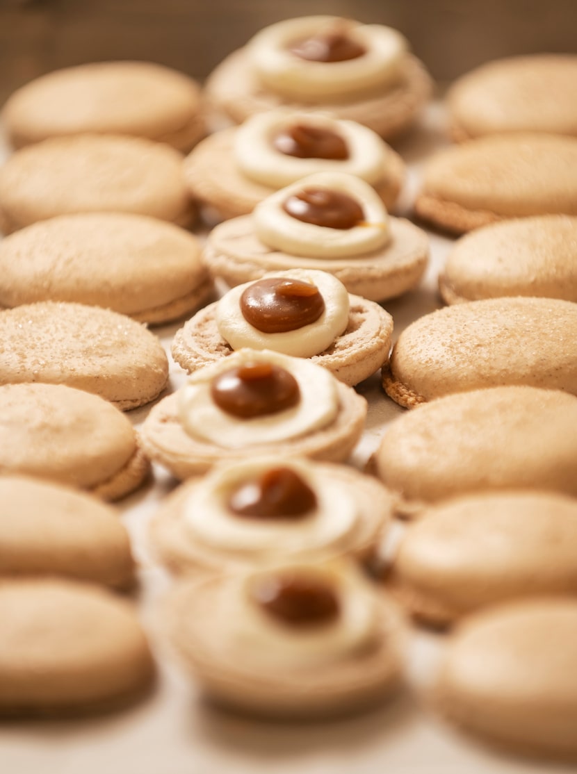 A row of macarons with churro flavored filling