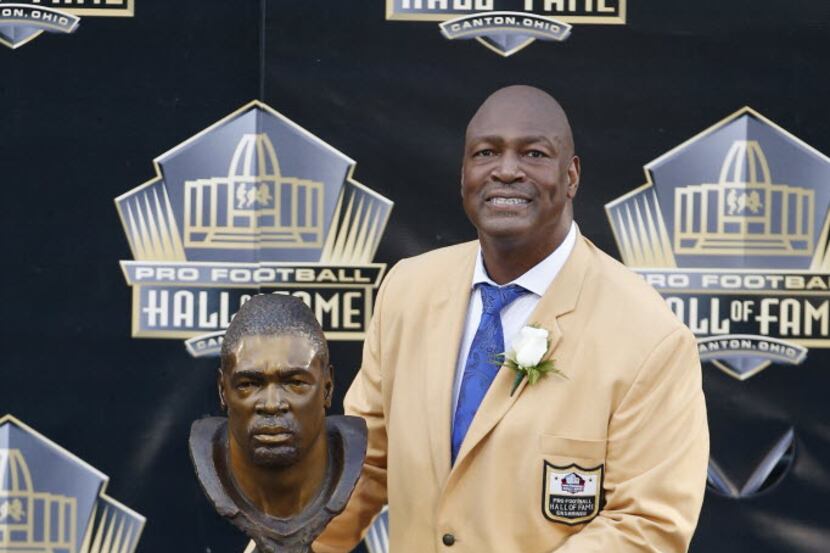 Charles Haley poses with his bust during the NFL Hall of Fame induction ceremony at Tom...