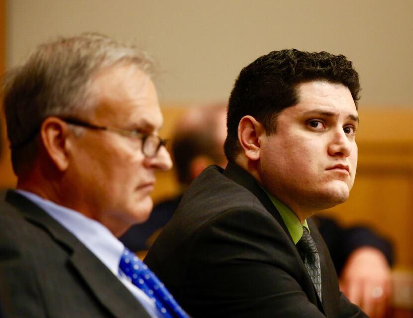  Enrique Arochi (right) sits with defense attorney Steven Miears during his trial in Collin...