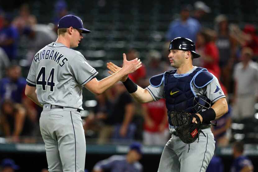 Tampa Bay Rays relief pitcher Peter Fairbanks (44) celebrates with catcher Mike Zunino (10)...