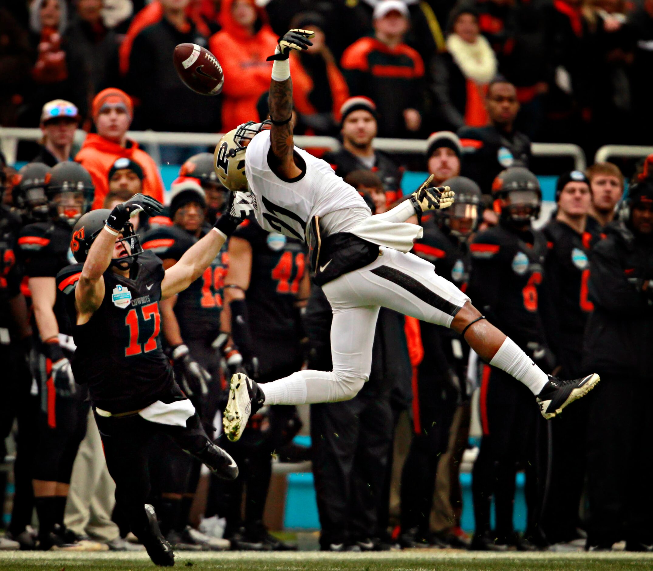 Purdue Boilermakers cornerback Ricardo Allen (21) breaks up a pass meant for Oklahoma State...