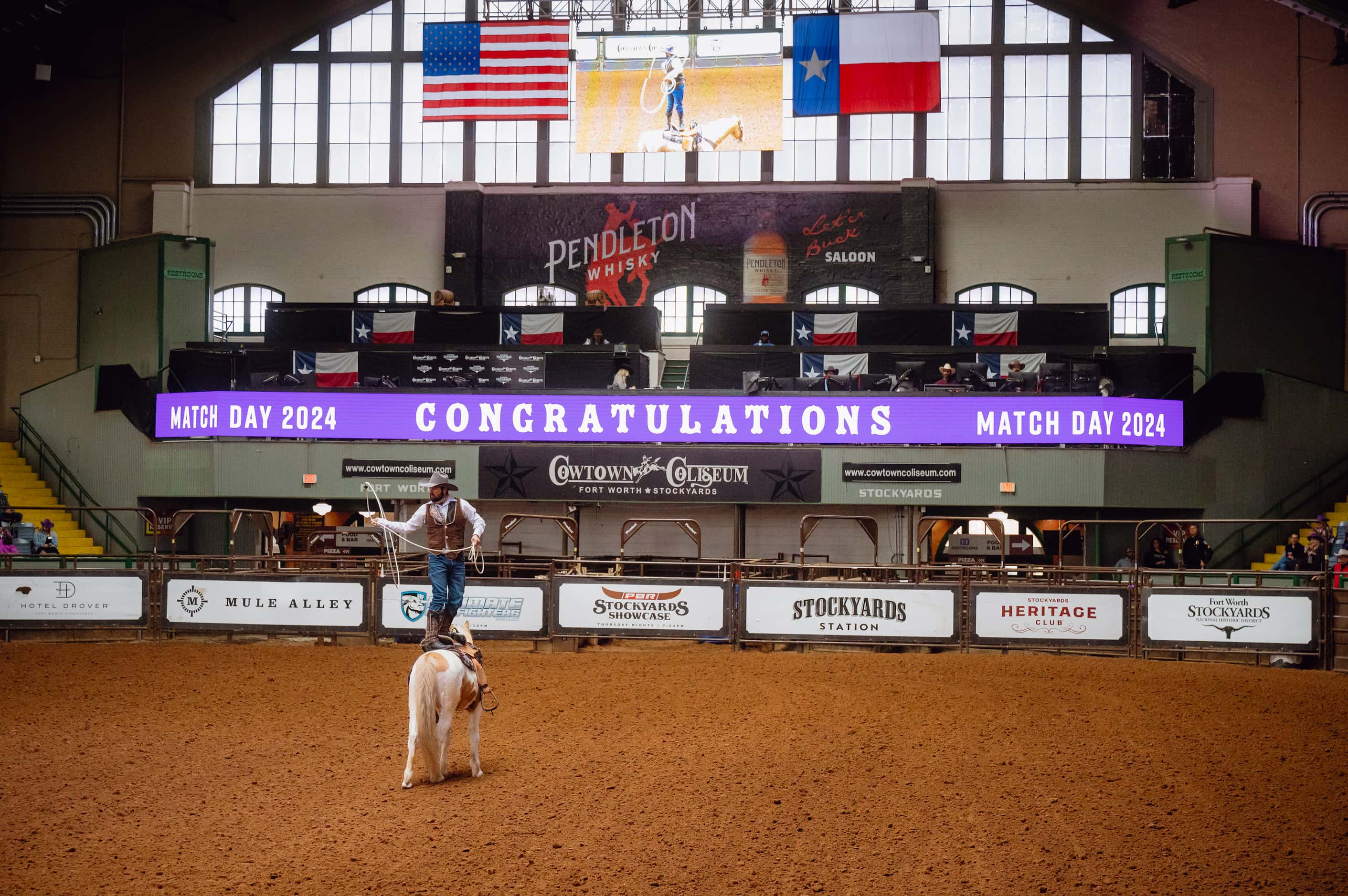 A cowboy performs at the start of TCU's Match Day event at the Cowtown Coliseum in Fort...