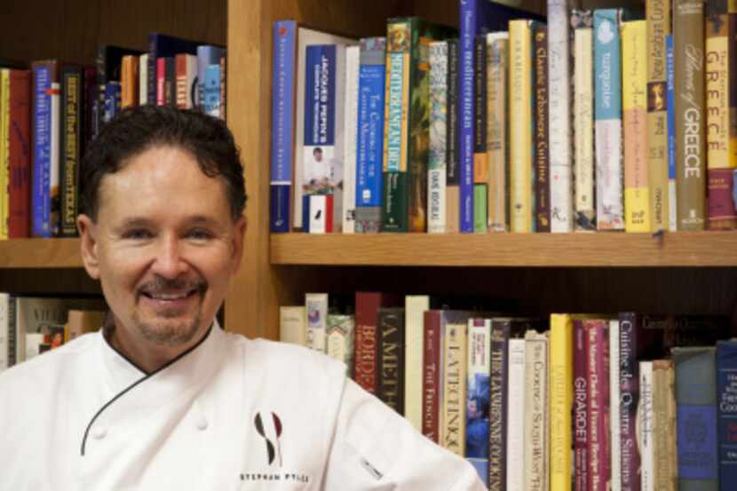 Chef Stephan Pyles with his in-home cookbook collection