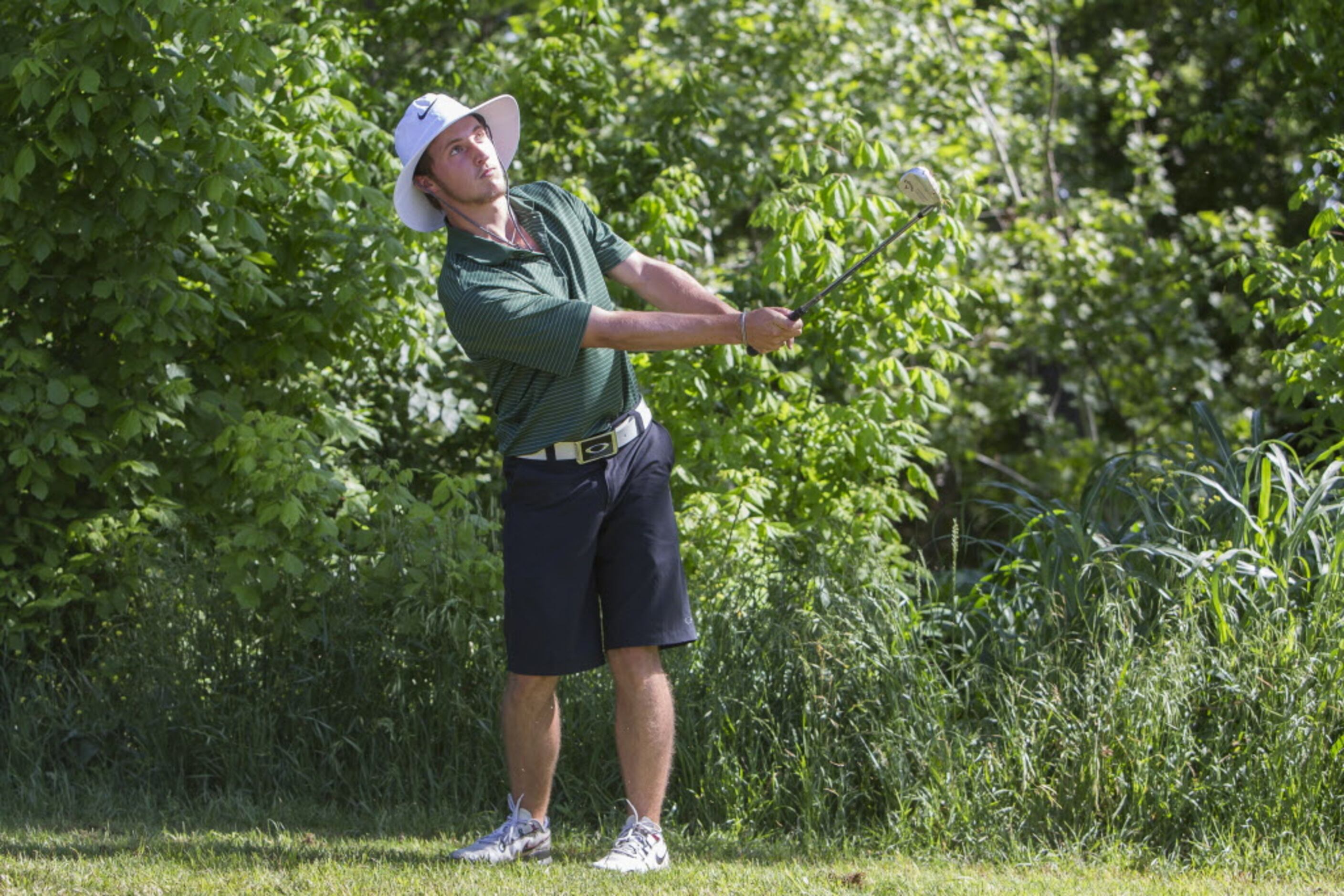 Southlake Carroll junior Hunter Glenn chips a shot onto the first green at the UIL 5A State...