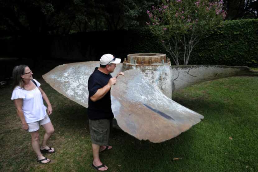 Richard and Sherry King of Pea Ridge, Ark., check out the 106-year-old propeller in the...