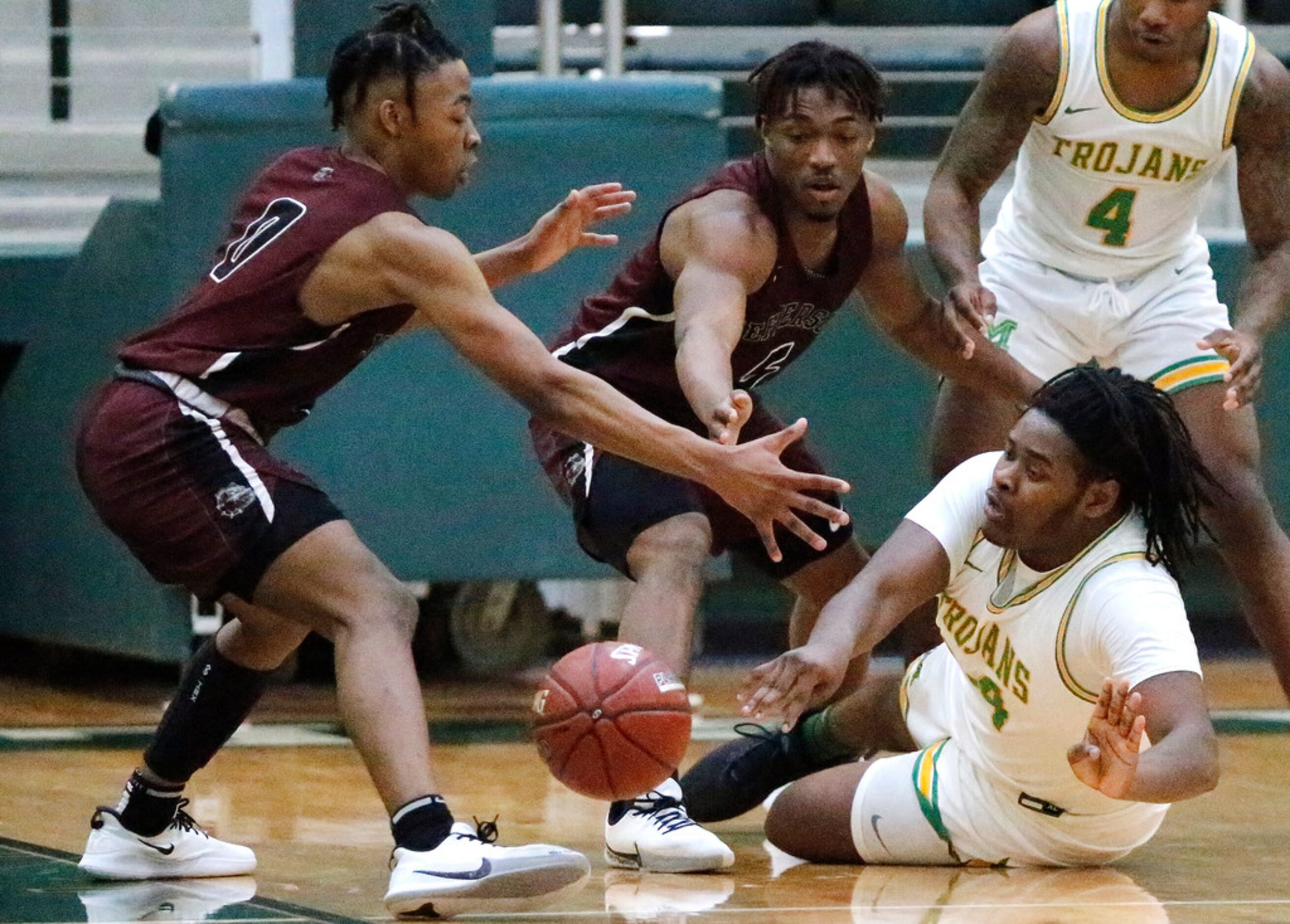 Jefferson High School guard Jakardan Davidson (0) and Jefferson High School guard Kylan...