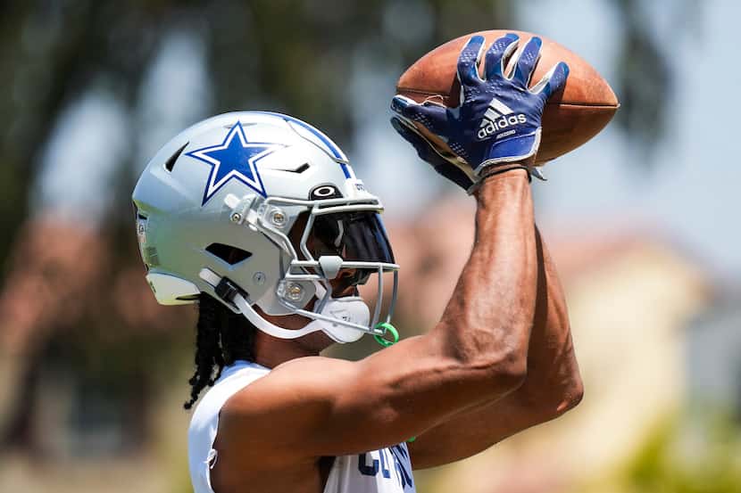 Dallas Cowboys wide receiver Jalen Tolbert catches a ball during a training camp practice on...
