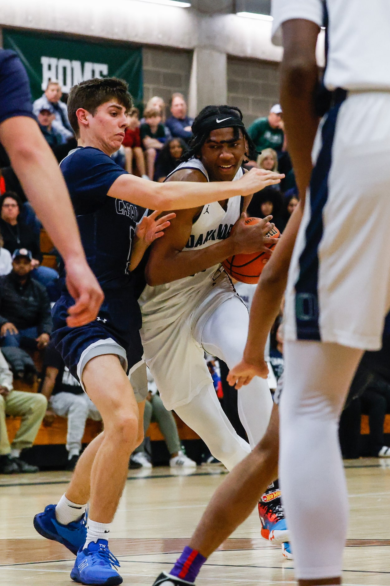 Oakridge Owls' Mitchell Holmes (13) tries to go for a shot as Casady Cyclones' Zac Dunn (1)...