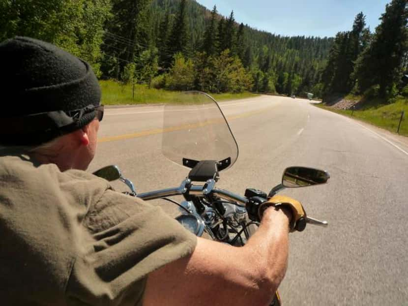 
With his father George driving and the writer on the back, the two speed through South...