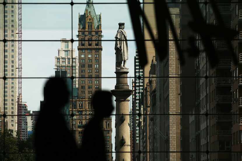  A 76-foot statue of explorer Christopher Columbus stands in Columbus Circle in New York...