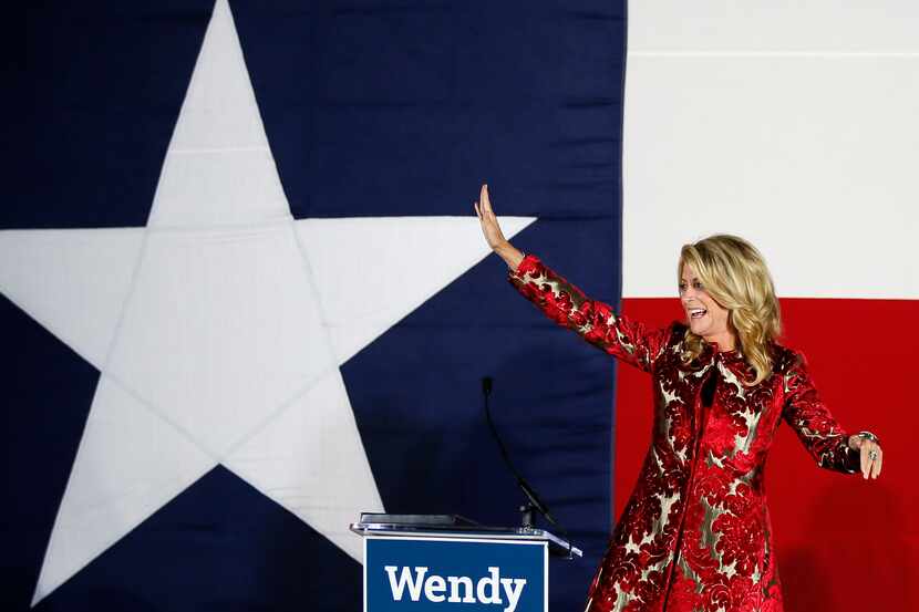 Texas Democratic gubernatorial candidate Wendy Davis waves to supporters after making her...