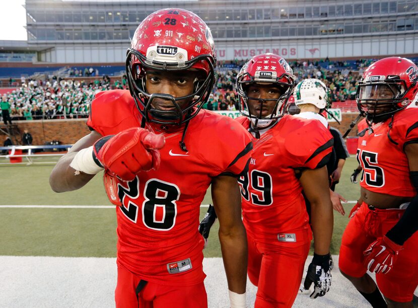 (TXHSFB) Cedar Hill RB Aca'cedric Ware (28) points to the camera at the end of the...