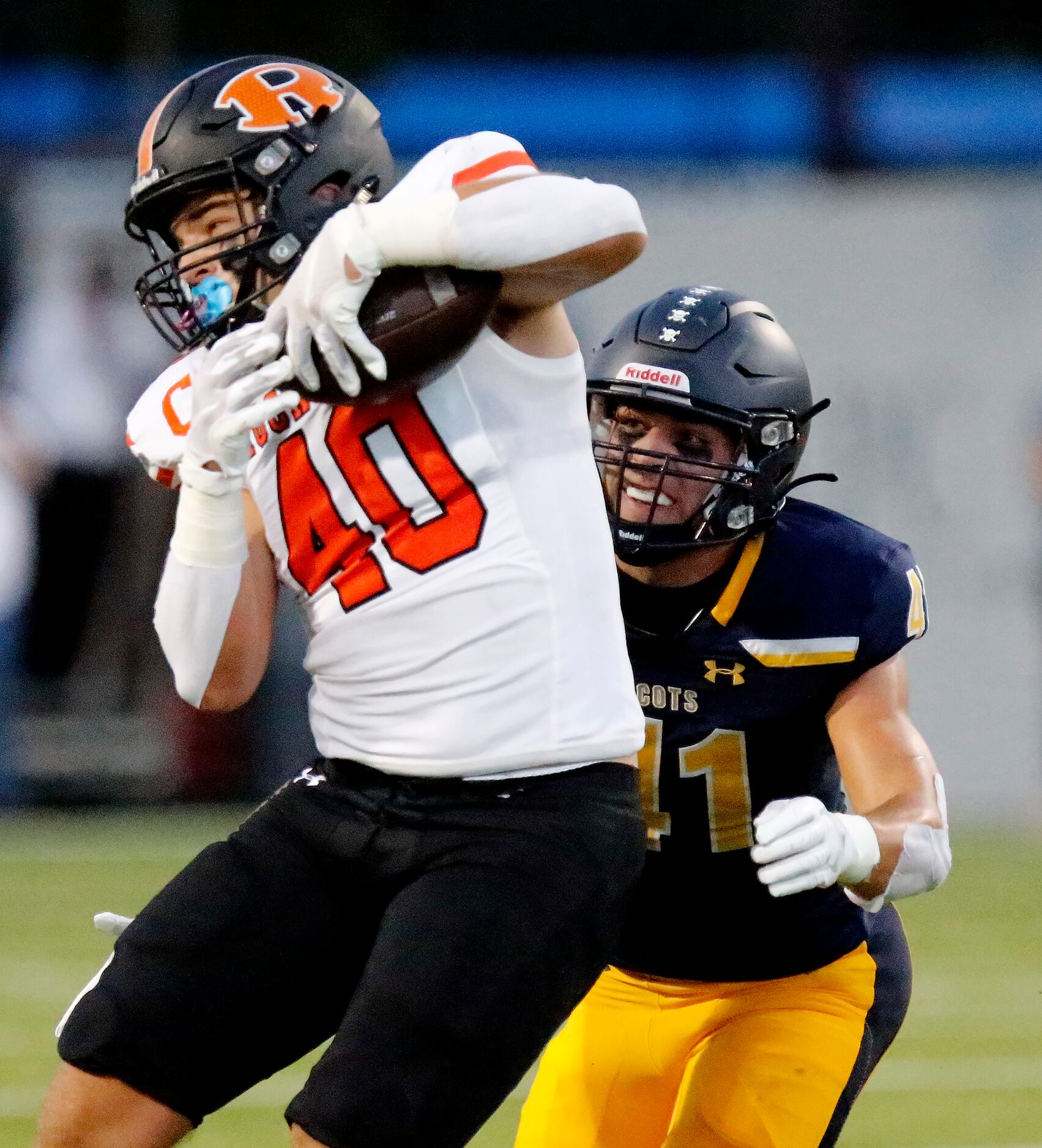 Rockwall High School tight end Brennan Ray (40) brings in a pass in front of Highland Park...