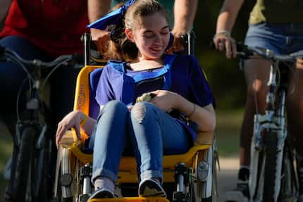 Shelby Sparks, 21, enjoys going for rides with her bicycling parents. Shelby has Dravet...