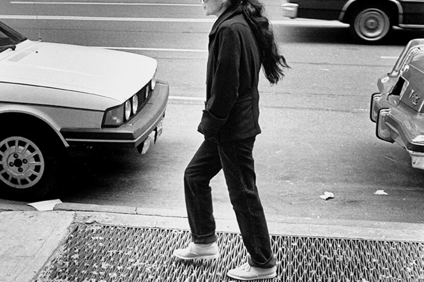  Yoko Ono walks close to the Dakota building in New York City in 1981. (David Woo/Staff...