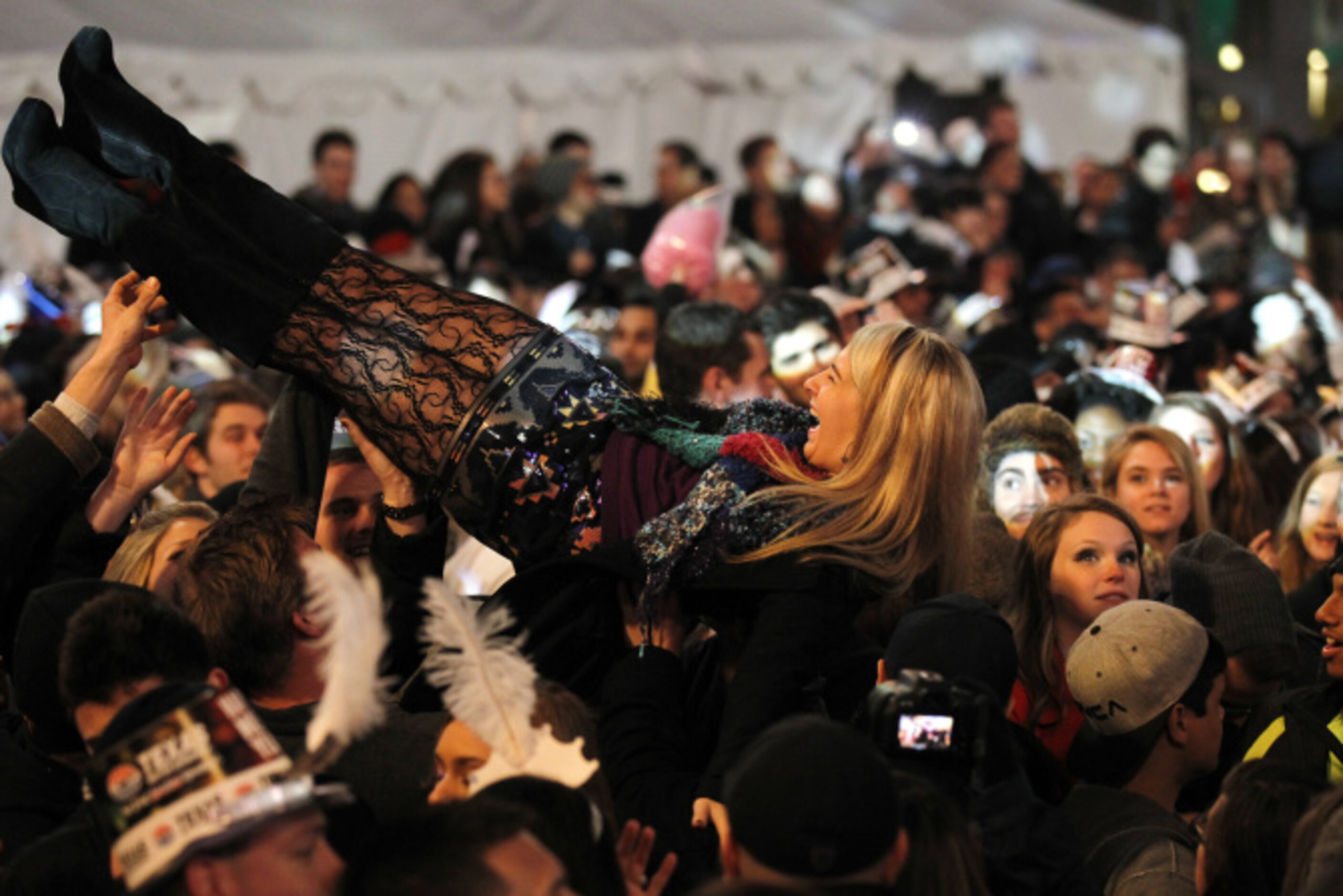 Crowd surfing at Big D New Years Eve celebration at American Airlines Center in Dallas...