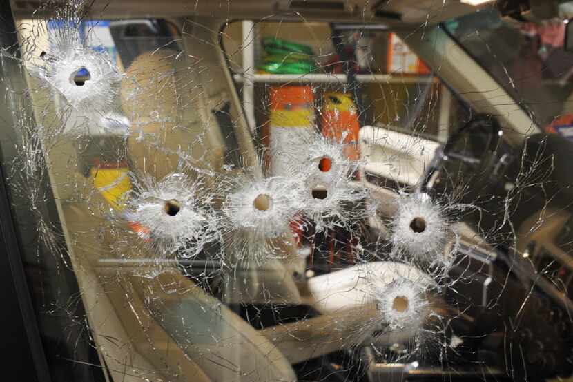 Bullet holes were left in the passenger-side window  of Juan Jesús Guerrero Chapa's Range...