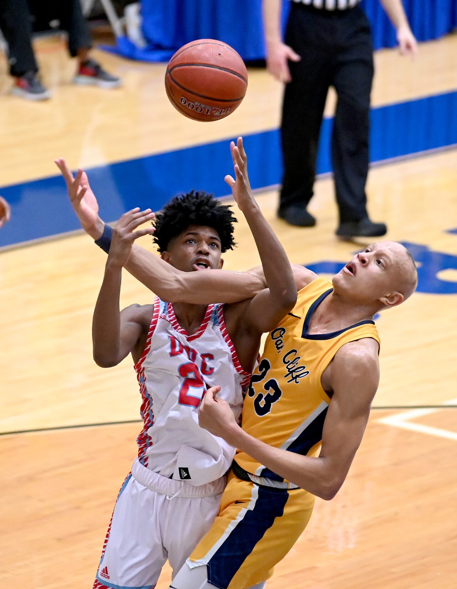 Carter’s Devin Lewis, in white, goes after a loose ball with Faith Family’s Jordan Walsh...