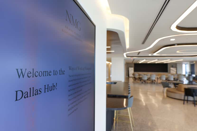 Electronic display reading “welcome to the Dalla Hub” near a conference room in Neiman...