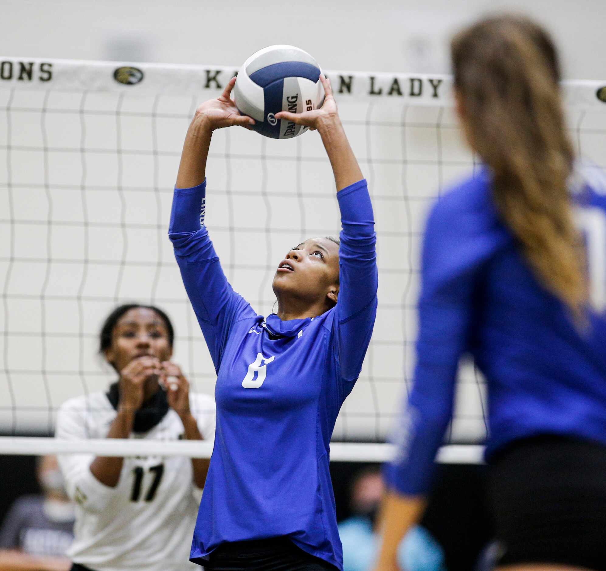 LindaleÕs Kalaya Pierce (6) sets the ball for a teammate during a high school volleyball...