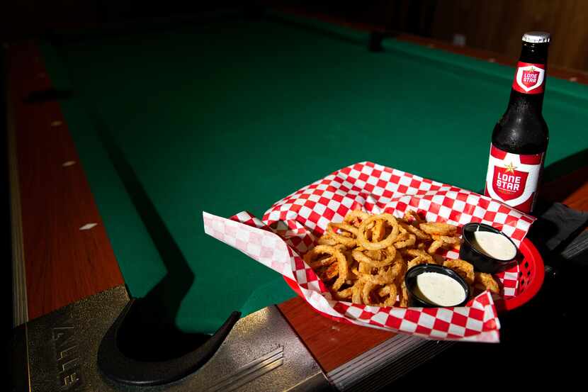 At Lakewood Landing in Dallas, you can pair a round of pool with some Noonday onion rings,...