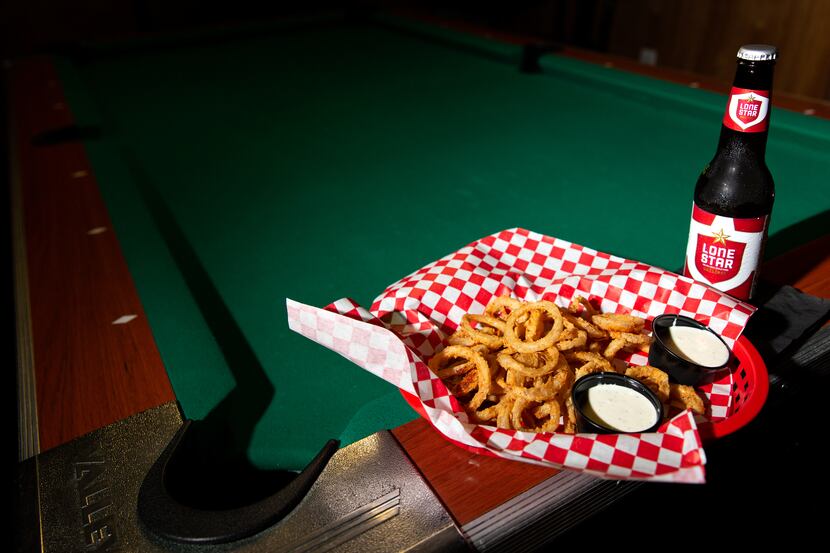 At Lakewood Landing in Dallas, you can pair a round of pool with some Noonday onion rings,...