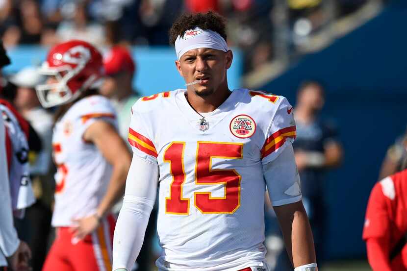 Kansas City Chiefs quarterback Patrick Mahomes (15) walks on the sideline after leaving the...
