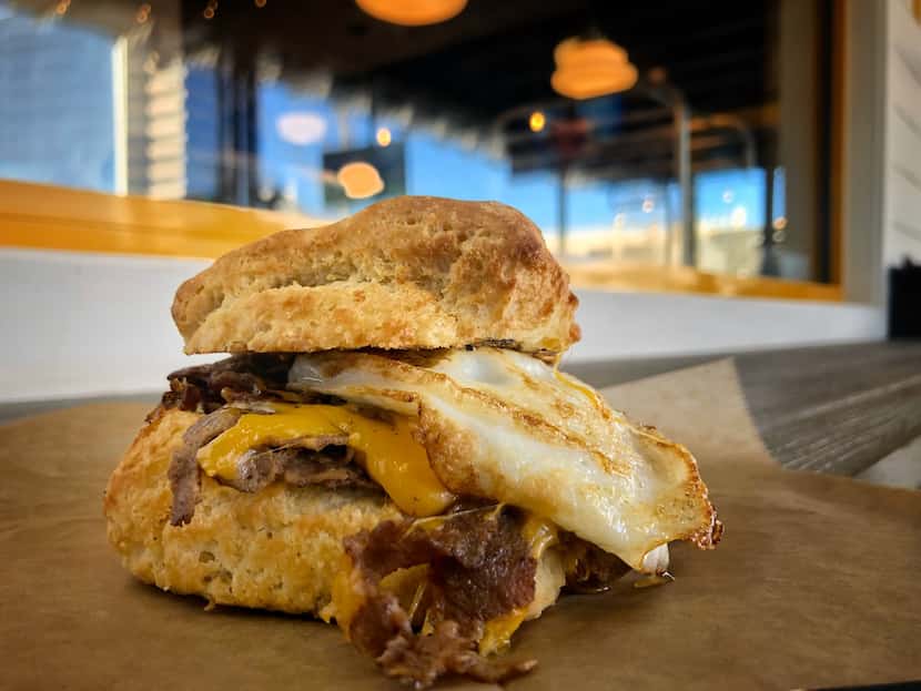 The Biscuit Bar serves a Steak & Egg biscuit, made with sliced ribeye, an egg over easy and...