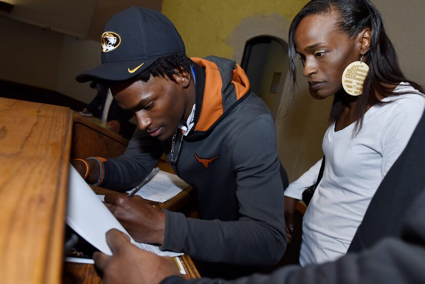 Duncanville cornerback Ennis Rakestraw, Jr., left, while wearing a University of Missouri...