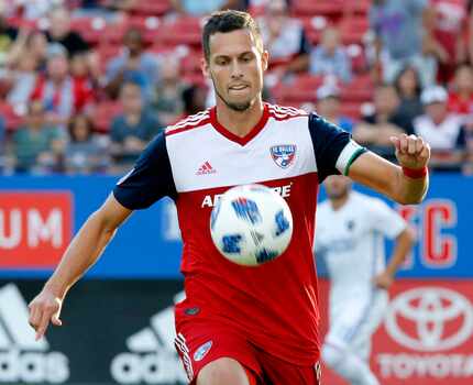 FC Dallas defender Matt Hedges (24) controls the soccer ball during the first half as FC...