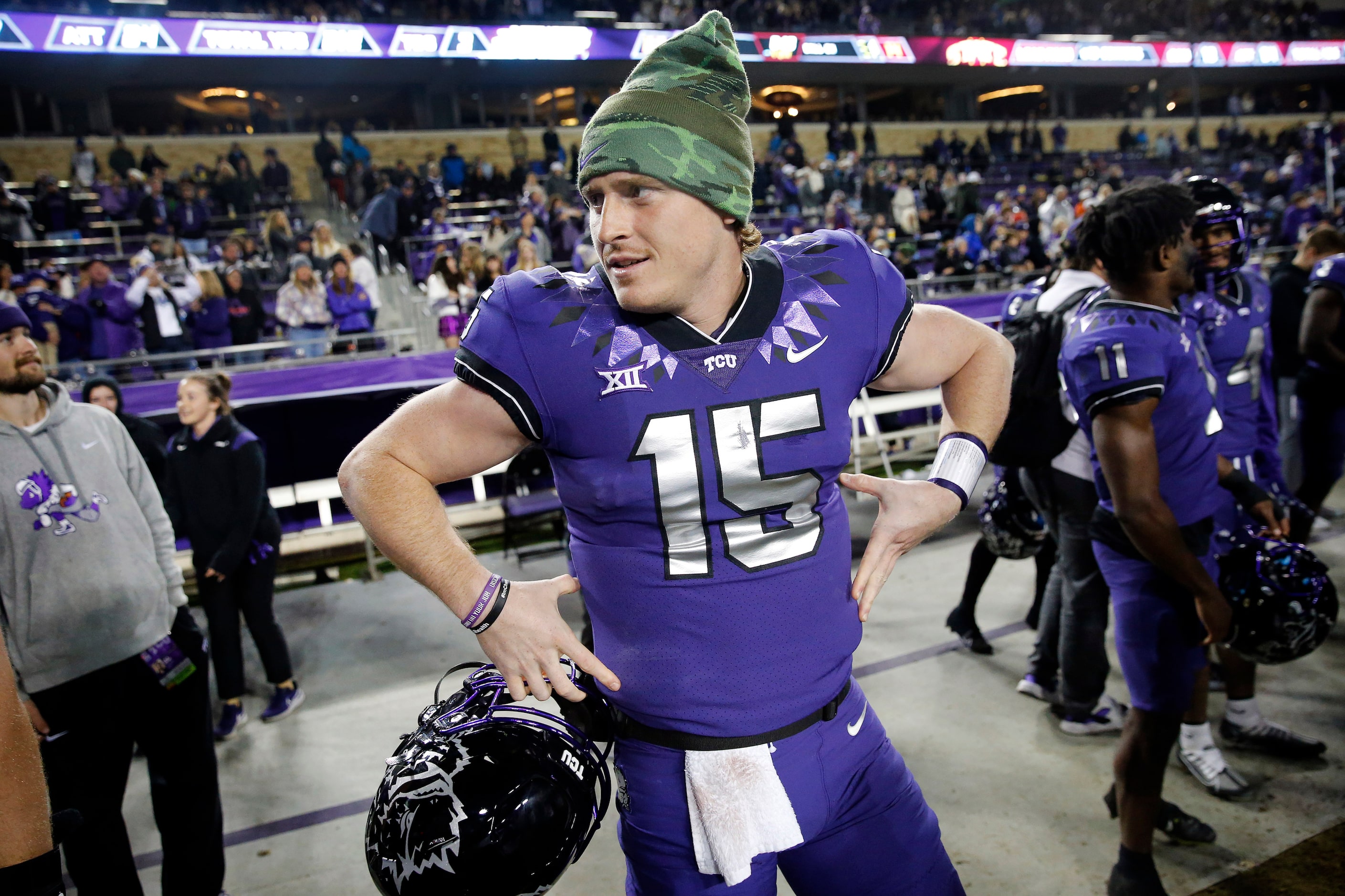 TCU Horned Frogs quarterback Max Duggan (15) donned a stocking hat as he sat out the fourth...