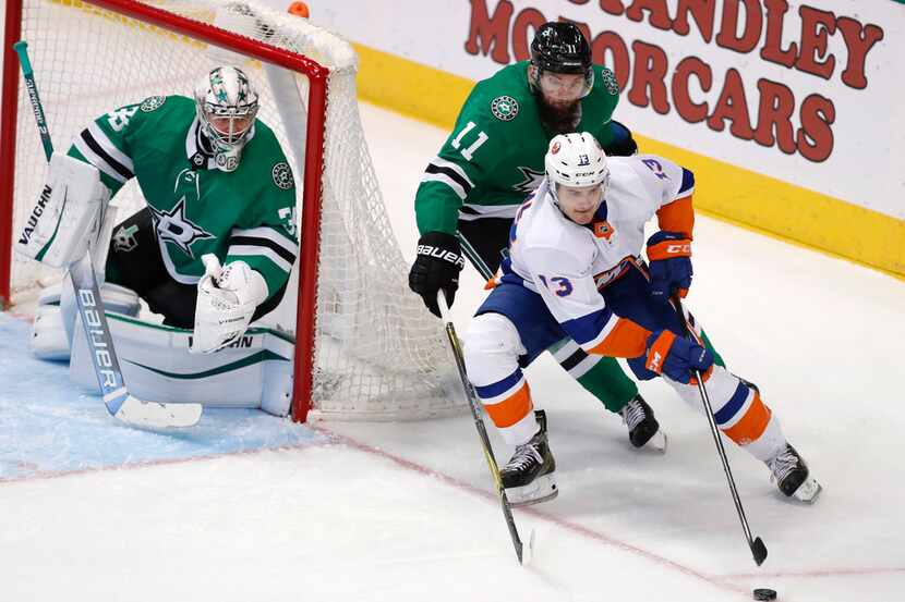 New York Islanders center Mathew Barzal (13) skates with the puck against Dallas Stars...