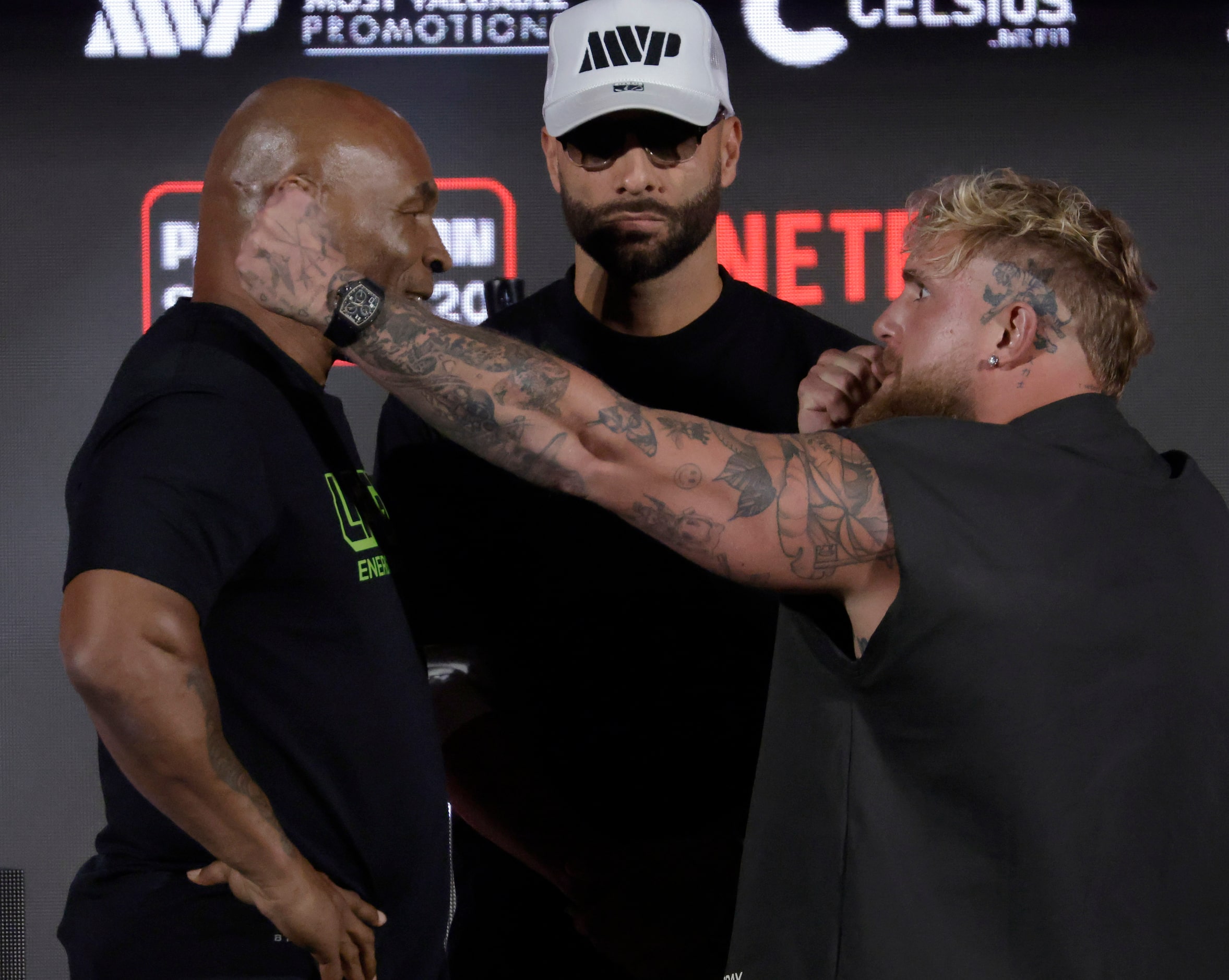 Ahead of their July fight at AT&T Stadium, boxers Mike Tyson (left) and Jake Paul pose for...