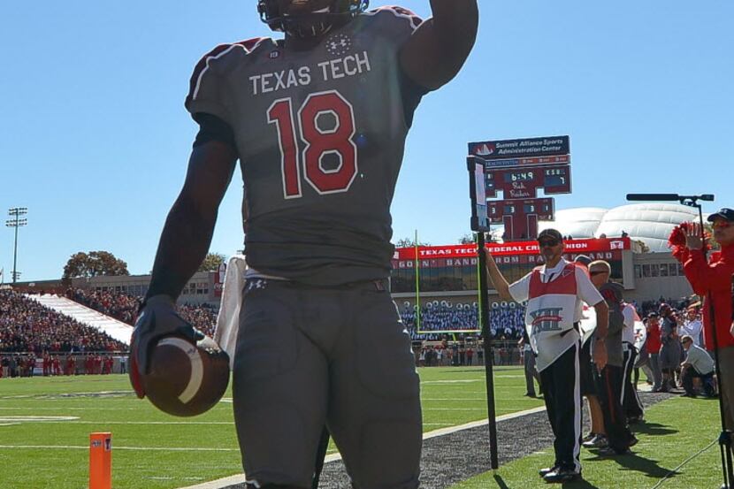 LUBBOCK, TX - NOVEMBER 9: Eric Ward #18 of the Texas Tech Red Raiders celebrates a touchdown...