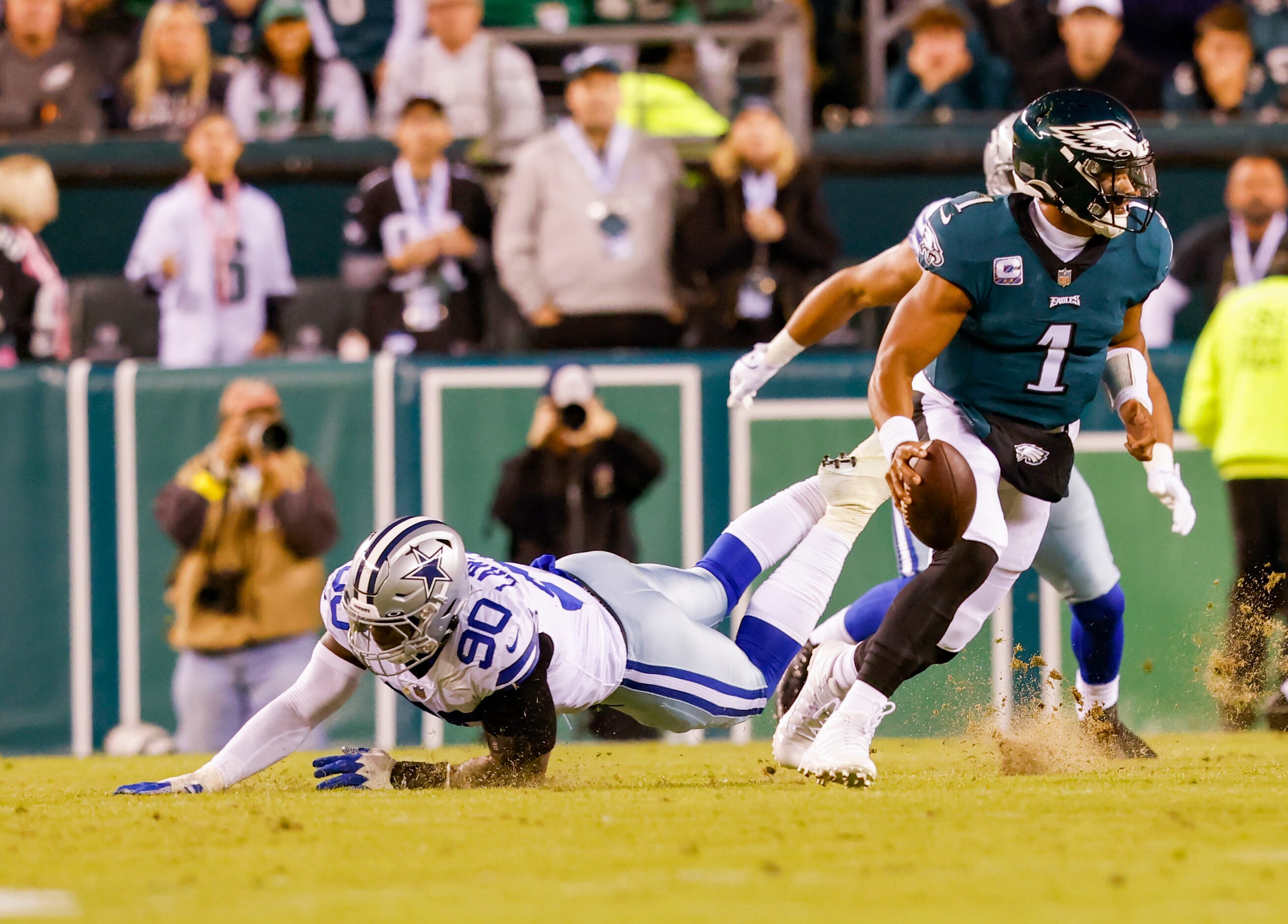 Dallas Cowboys defensive end DeMarcus Lawrence (90) misses Philadelphia Eagles quarterback...